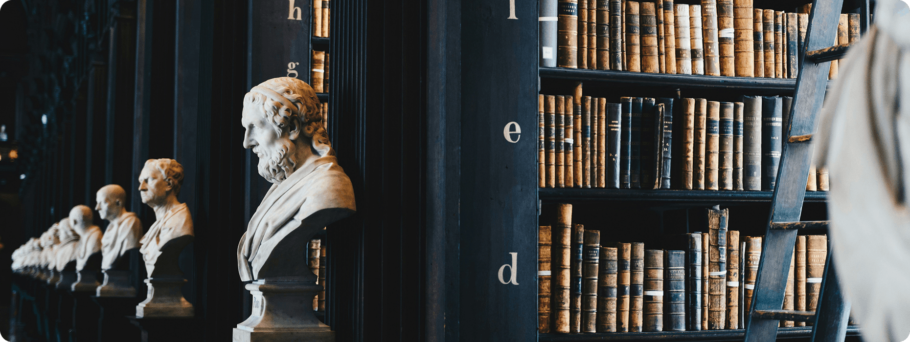 Classical legal scholars and historic books in a library